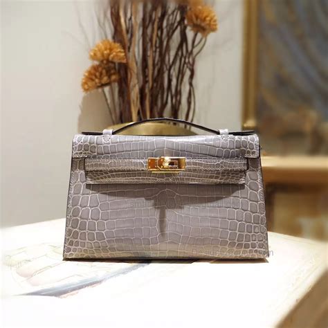 kelly pochette vs hermes clutch